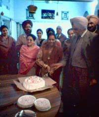 Dr Saradara Singh Johl celebrates the declaration of Padma Bhushan award to him in Ludhiana on Saturday as his family members and friends look on.