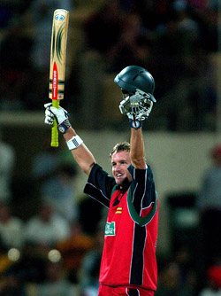Sean Irvine of Zimbabwe acknowledges the crowd's applause after completing his maiden century 