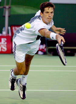 Britain's Tim Henman, the number 11 seed, dives for a volley during his third round match against Argentina's Guillermo Canas