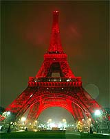 The Eiffel Tower is lit in red during a test-run ahead of Chinese New Year festivities in Paris