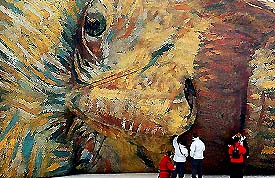 People watch a hot-air balloon bearing the face of Dutch painter Vincent Van Gogh 