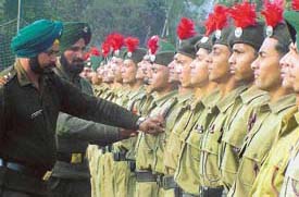 Instructors of NCC cadets direct them during a rehearsal parade in Ludhiana on the eve of Republic Day