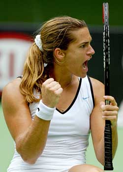 Fourth seed Amelie Mauresmo of France celebrates her fourth round victory over Australia's Alicia Molik