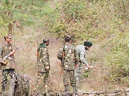 Army personnel collect misfired shells from Chandi Mandir cantonment, near Panchkula, on Monday.