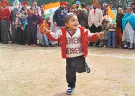 A child enjoys the Republic Day celebrations at SAS Nagar on Monday