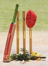 The cap and bat of the late David William Hookes is seen during a funeral service for him at the Adelaide Oval