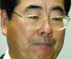 Sony Corp senior vice-president Takao Yuhara bites his lip
