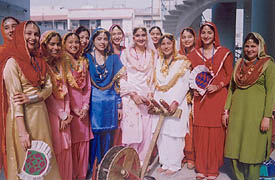 Students of RS Model Senior Secondary School dressed in traditional Punjabi attire during National Youth Day celebrations held in the school 