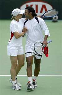 India's Leander Paes congratulates Martina Navratilova of the USA after their mixed doubles match against Australia's Paul Hanley and Trudi Musgrave at the Australian Open