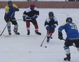 Army and Jammu and Kashmir teams play ice hockey in the inaugural match of fourth National Winter Games at Gulmarg on Wednesday