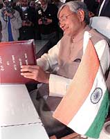 Union Minister of Railways Nitish Kumar gives finishing touches to the Interim Railway Budget in New Delhi on Thursday.