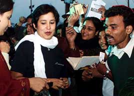 Exiled Bangladeshi author Tasleema Nasreen walks past her fans at the Kolkata Book Fair 