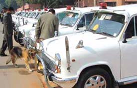 Securitymen with a sniffer dog checking the parking area of Parliament House during the last session of the 13th Lok Sabha in the Capital on Thursday.