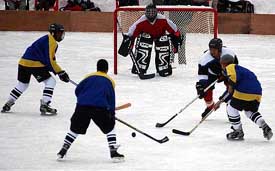 players of J&K Reds and J&K Blues in action during their ice-hockey match 