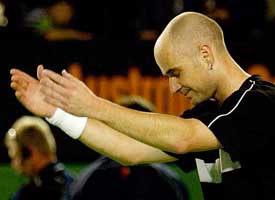 Fourth seed Andre Agassi of the US bows to the crowd after his semifinal match against Russia's Marat Safin at the Australian Open 