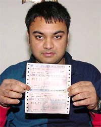 Vinay Bhardwaj, a resident of Sector 42, Chandigarh, shows confirmed tickets of the Unchahar Express which has been discontinued for the past one month