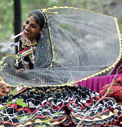 A folk dancer performs at the 18th Surajkund craft mela 