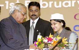 Prime Minister Atal Bihari Vajpayee being presented with a floral bouquet at the Global Convention on Peace and Non-violence in New Delhi 