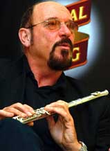 Ian Anderson, the flute and voice behind the legendary British rock band Jethro Tull, displays his flute while speaking at a media gathering in Mumbai 