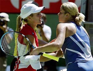 Justine Henin-Hardenne from Belgium shakes hand with compatriot Kim Clijsters after their final match at the Australian Open 