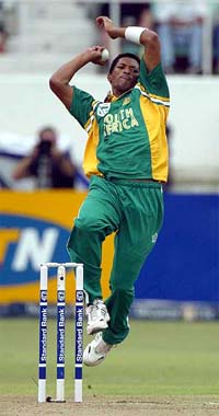 South African fast bowler Makhaya Ntini bowls during a one-day international match against the West Indies at Kingsmead cricket stadium in Durban