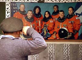 An NCC cadet salutes the astronauts of the ill-fated Columbia space shuttle on their first death anniversary
