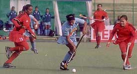A tense moment in the hockey match between India and Malaysia in the fifth women�s Asia Cup
