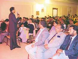 A speaker addresses a seminar
