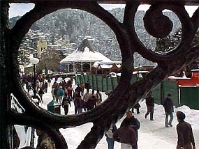 Tourists enjoy the snow in Shimla on Monday