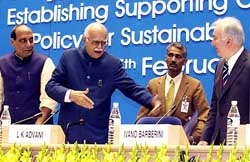 Deputy Prime Minister L.K. Advani and Union Agriculture Minister Rajnath Singh with Ivano Barberini, president of International Cooperative Alliance