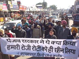 Dismissed clerks hold a protest march on the Mall Road in Patiala on Monday