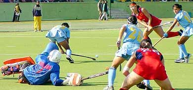 Mamta Kharab clears the ball to safety after custodian Helen Mary was deceived by a Chinese forward in their pool A match