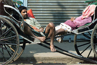 Rickshaw-pullers take their afternoon naps in Kolkata on Tuesday during the statewide 12-hour strike 