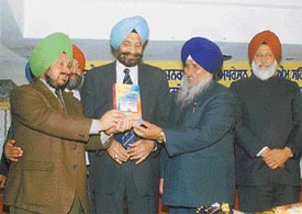 The Chairman of the National Minorities Commission, Mr Tarlochan Singh, releases a book of Mr Swarup Singh Alag