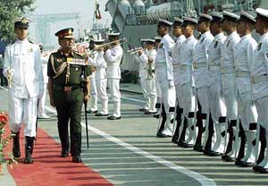 Army Chief General N. C. Vij inspects a guard of honour during the inauguration of INS Karmuk in Kolkata 