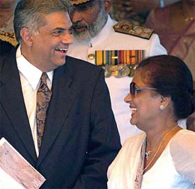 Sri Lankan President Chandrika Kumaratunga and Prime Minister Ranil Wickremesinghe share a light moment during Sri Lanka�s 56th independence celebration in Colombo 