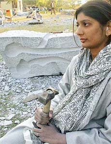 Sculptor Ratna Bhavsar in a reflective mood by the side of an image she is creating during the ongoing National Sculptors� Workshop at the Leisure Valley, Sector 10, Chandigarh