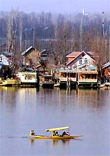 Tourists enjoy a shikara ride at Dal Lake