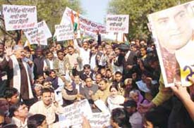 Delhi Pradesh Congress Committee holds a demonstration to protest against the BJP-led NDA government for dragging the name of former Prime Minister Rajiv Gandhi in the Bofors issue at Parliament Street in the Capital on Thursday. 
