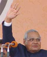 Atal Bihari Vajpayee waves to the gathering during the Vijay Sankalp Rally in the Capital