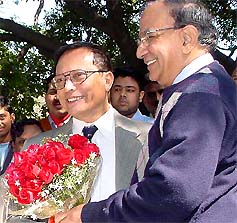 Outgoing CEC J.M. Lyngdoh receives a bouquet from his successor T.S. Krishna Murthy in New Delhi