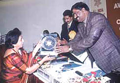 Union Minister of State for Communications and Information Technology Ashok Pradhan honouring Mrs Mamta V. Bhatnagar, principal and director, Manav Sthali School.