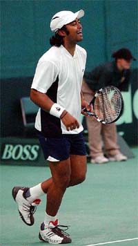 Indian captain Leander Paes celebrates after defeating Simon Rea of New Zealand
