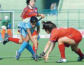 India's Sanggai Chanu is tackled by an unidentified Japanese player 
