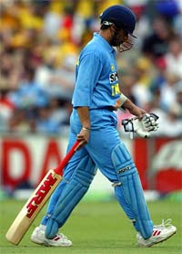 Sachin Tendulkar walks off the ground after being dismissed during the second final of the tri-nations tournament against Australia in Sydney