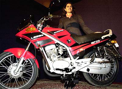 Joint Managing Director of Kinetic Engineering Ltd Sulajja Firodia Motwani poses by the newly launched Kinetic Laser motorcycle