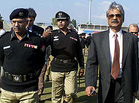 Pakistani DIG Chaudry Iftikhar escorts IG Yasovardhan Azad during a security check round at Pindi cricket stadium 