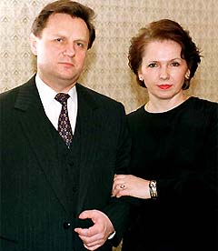 Russian politician Ivan Rybkin poses with his wife Albina at his country house outside Moscow in this file photograph