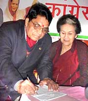 Dr Dhani Ram Shandil with Himachal Congress president Vidya Stokes at the Himachal Congress office