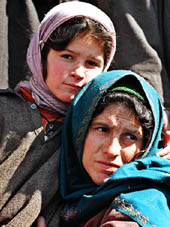 Shamima Begum, wife of Mohammad Aslam Mir, who was killed in Bandipora with four other civilians, with her daughter